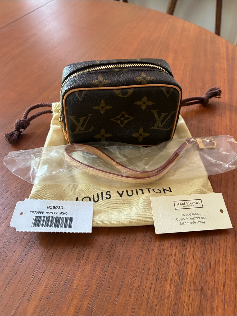 Louis Vuitton Monogram Mini Pouch in Brown and Gold Trim